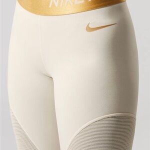 Nike Dri-FIT Cream Leggings with Gold Details
